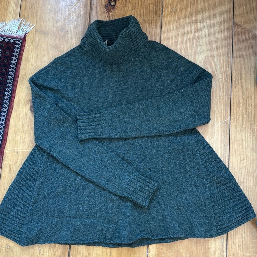 Balenciaga knit wool turtleneck sweater with flattering slight flare at …